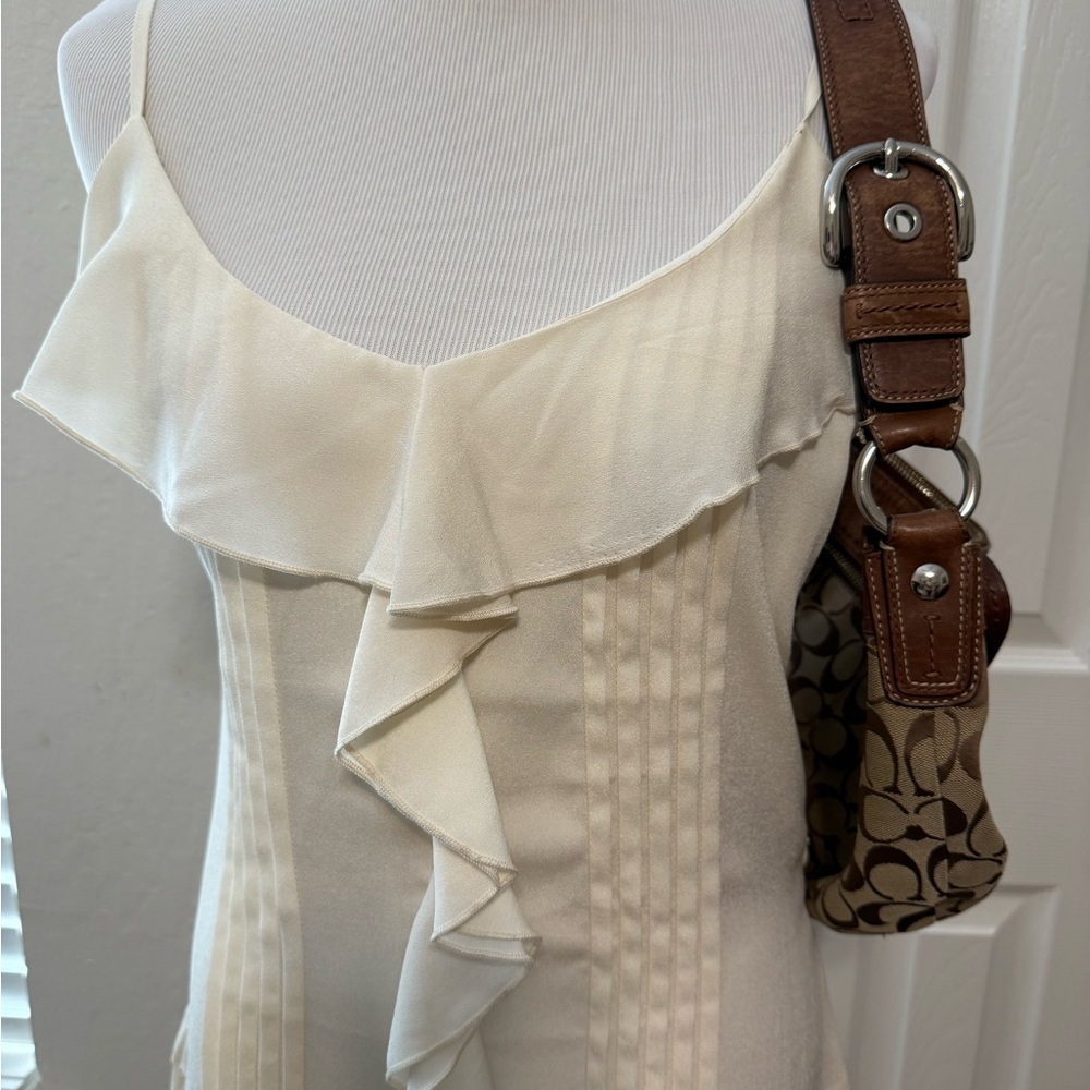 Elegant dress with ruffle details, perfect for a sophisticated occasion.